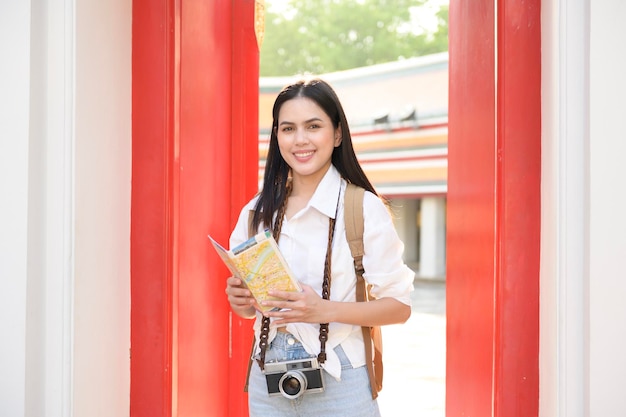 Beautiful tourist woman on vacation sightseeing and exploring Bangkok city Thailand