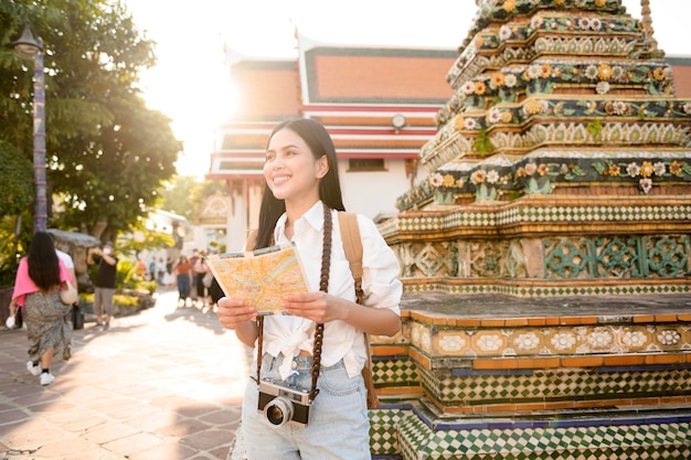 Beautiful tourist woman on vacation sightseeing and exploring Bangkok city Thailand