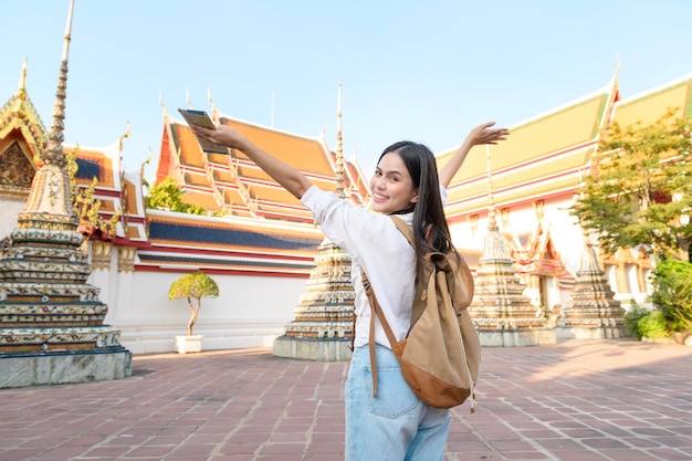 Beautiful tourist woman on vacation sightseeing and exploring Bangkok city Thailand