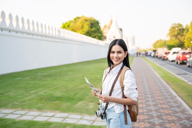 Beautiful tourist woman on vacation sightseeing and exploring Bangkok city Thailand