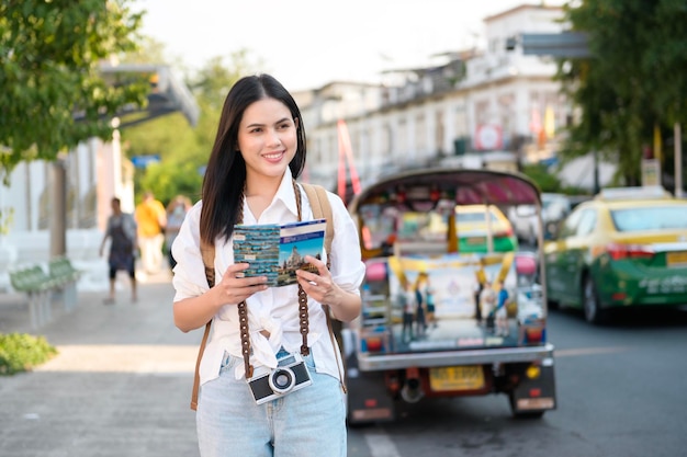 Beautiful tourist woman on vacation sightseeing and exploring Bangkok