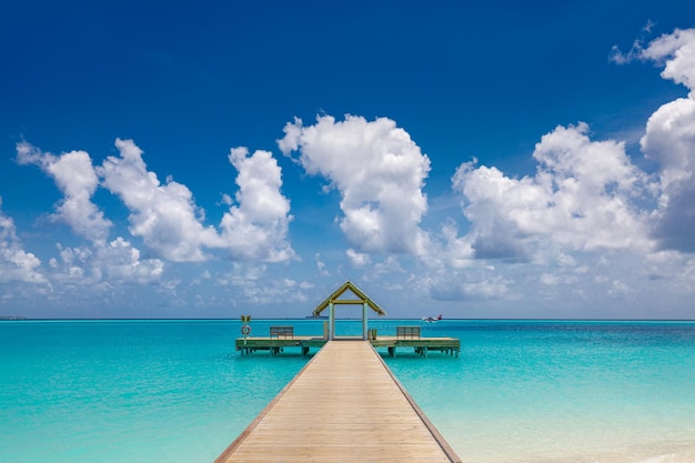 Beautiful tropical Maldives island with beach amazing sea view pier blue sky Summer travel