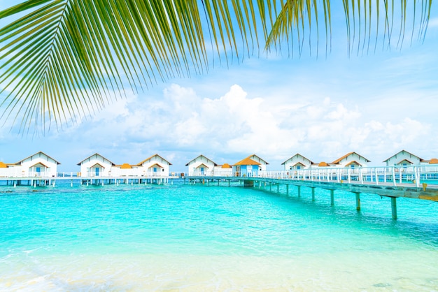 Beautiful tropical Maldives resort hotel and island with beach and sea