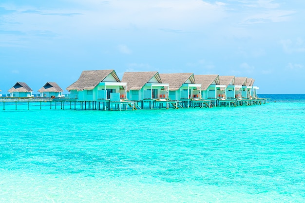 Beautiful tropical Maldives resort hotel and island with beach and sea