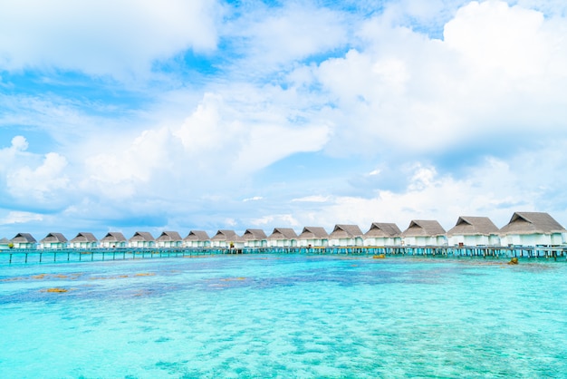 Beautiful tropical Maldives resort hotel and island with beach and sea 