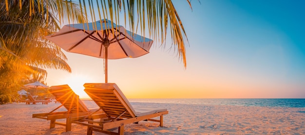 Beautiful tropical sunset couple chairs loungers umbrella under palm tree Romantic vacation