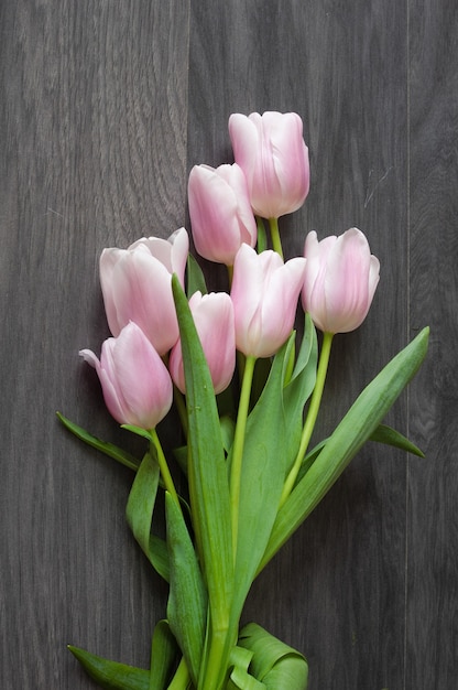 Beautiful tulips bouquet on gray background