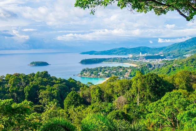 Beautiful turquoise ocean waives with boats and sandy coastline from high view point. Kata and Karon beaches, Phuket, Thailand