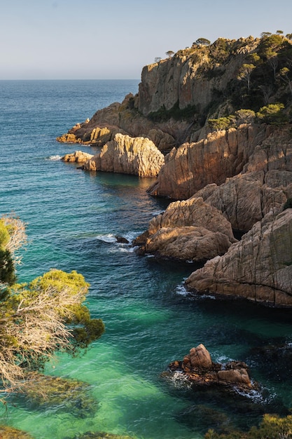 Beautiful turquoise water in Costa Brava in Catalonia of Spain in the sunset light