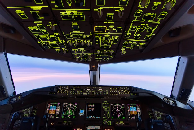 Beautiful twilight sunset sky at high altitude from airplane cockpit view. 