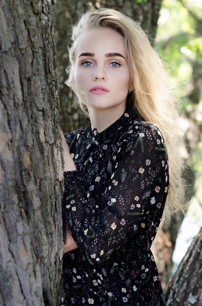 Beautiful Ukrainian girl sits by the river