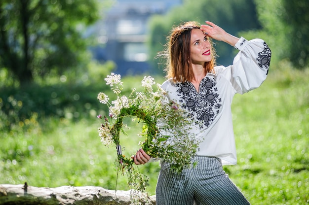 Beautiful ukrainian young woman dressed to traditional modern ethnic dress.