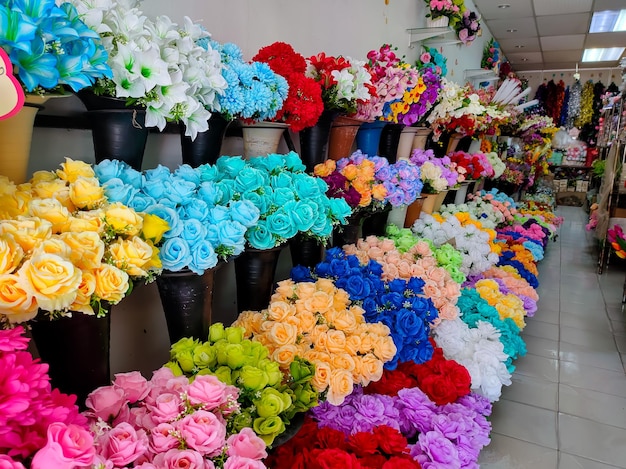 Beautiful various colors of artificial flowers sold in a store selling sewing and wedding tools