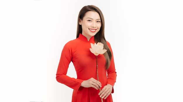 Beautiful vietnamese girls dressed traditional Ao Dai red dress Vietnamese girl holding a lotus flower