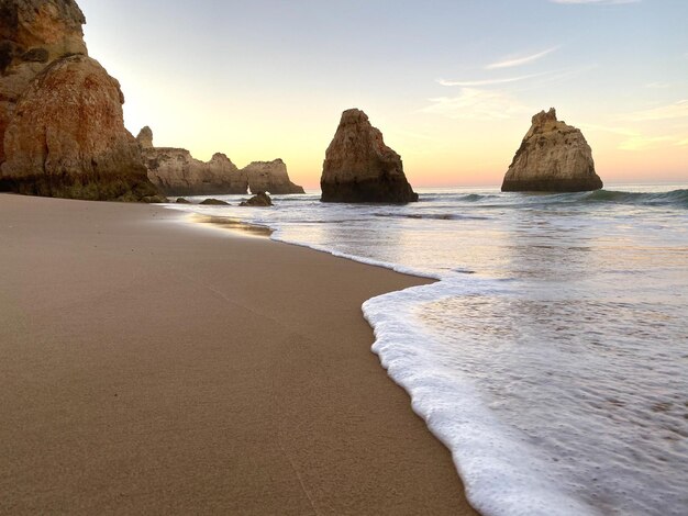 Beautiful view of the beach against scenic sunset in Alvor Portugal