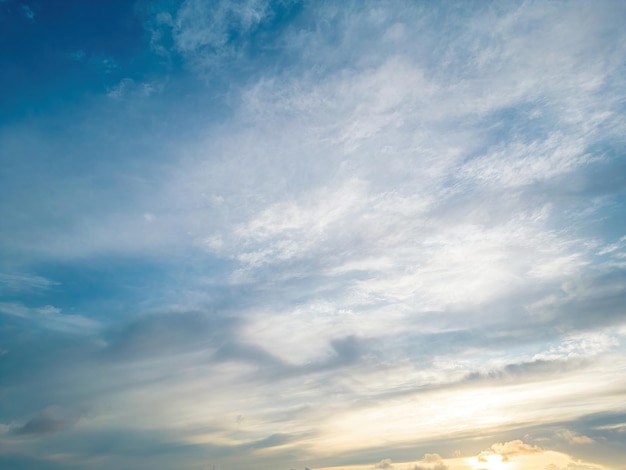 Beautiful view of blue sky with clouds at sunrise Partly cloudyBackground cloud summer Cloud summer Sky cloud clear with sunset Natural sky cinematic beautiful yellow and white texture background