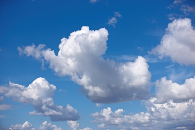 Beautiful view of cumulus clouds in a blue sky with copy space from below Soft cloudscape with fluffy aerosol during the day Puffy white clouds symbolizing enlightenment spirituality and heaven