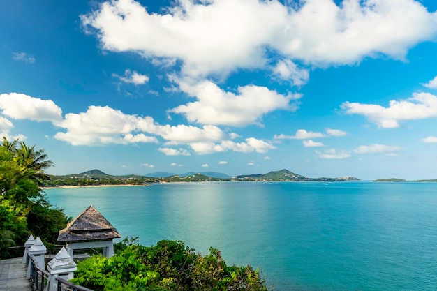 Beautiful view from the hill to Koh Samui Triangular roof turquoise sea and green mountains