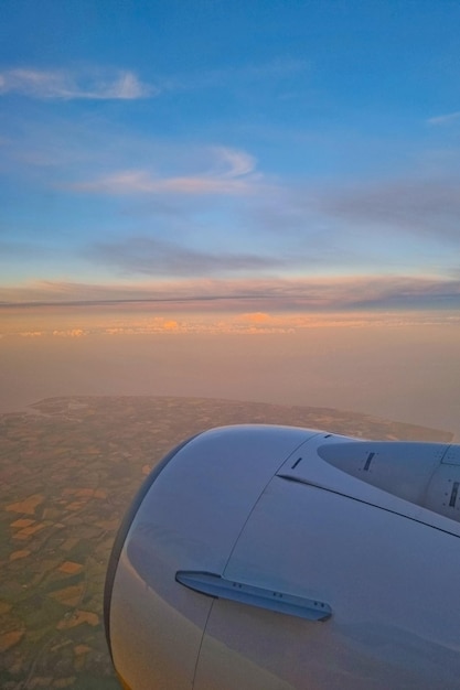 Beautiful view from the window of a flying plane at dawn