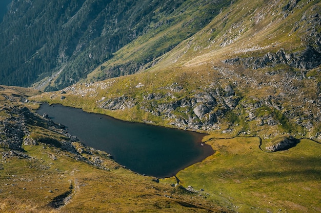 Beautiful view of a lake and green hills in spring