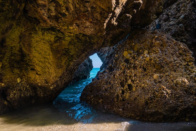 Beautiful view of the Mediterranean sea through rock formations at Nerja beach