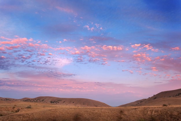 Beautiful view at the mountain valley at colorful sunset