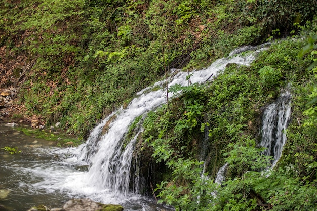 Beautiful view of natural waterfall with crystal clear water amo