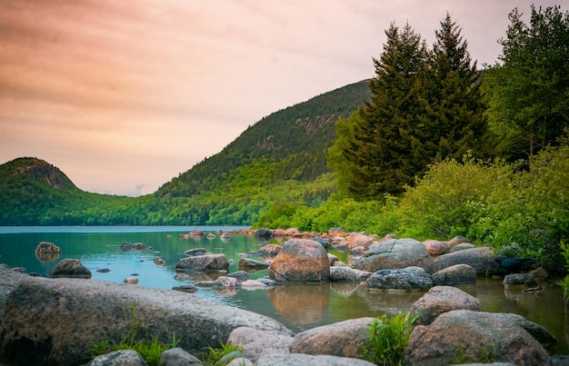 Beautiful view of a river and mountain forests at sunset in Arcadia National Park Maine