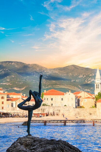 Beautiful view of the sculpture Ballerina Dancer of Budva at sunset, Budva, Montenegro