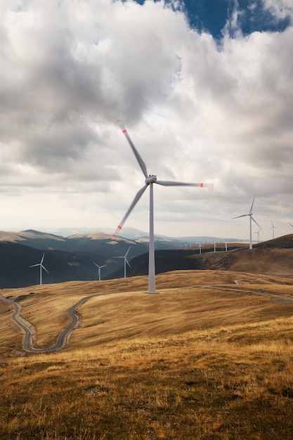 Beautiful view of the wind turbines on a cloudy landscape.Wind energy generator