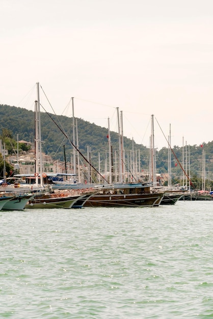 Beautiful views of the harbor with ships on a background of mountains