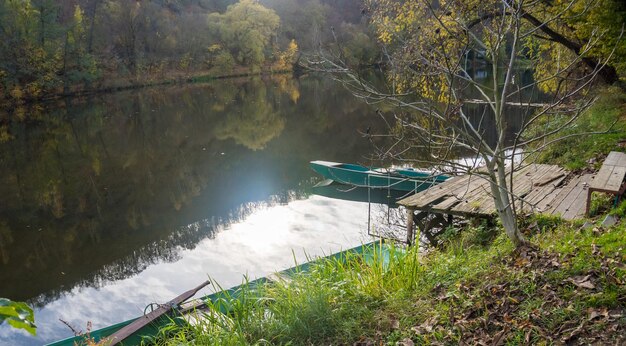 Beautiful views of the river berounka a wooden boats in the autumn season