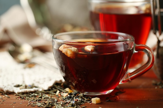 Beautiful vintage composition with herbal tea on wooden table