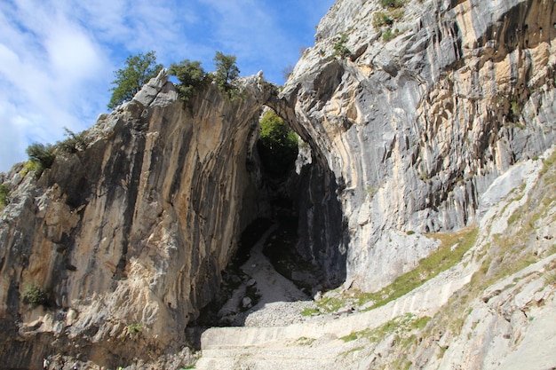 Beautiful walls on the trail in the Picos de Europa on the route of Cares Asturias vertical photo