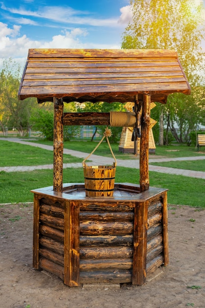 Beautiful water well in the Park. Vertical photo