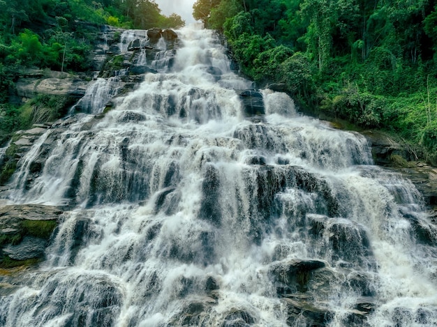 Beautiful waterfall in lush tropical green forest Nature landscape Mae Ya Waterfall in Doi Inthanon