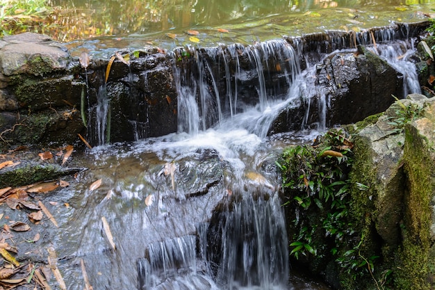 The beautiful waterfalls, rapids and mountain streams in the tropical forest in Yanoda Park,  Sanya city. Hainan island, China.