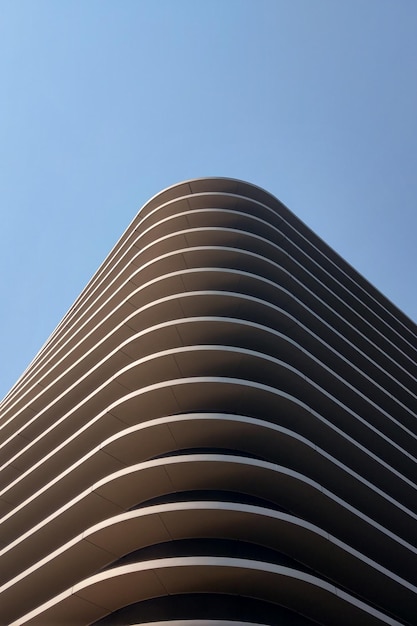 Beautiful wavy modern architecture of the building against the sky