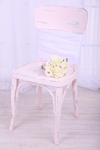 Beautiful wedding bouquet on chair