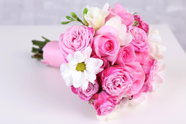 Beautiful wedding bouquet on grey wall background