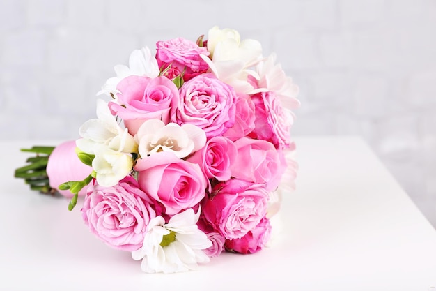 Beautiful wedding bouquet on grey wall background