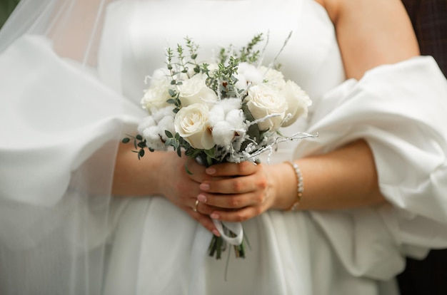 beautiful wedding bouquet in the hand of the bride