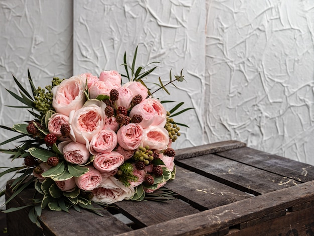 Beautiful wedding bouquet of shrub and peony gently pink roses.