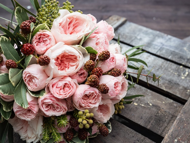 Beautiful wedding bouquet of shrub and peony gently pink roses.