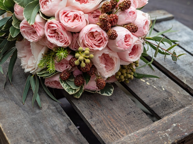 Beautiful wedding bouquet of shrub and peony gently pink roses.