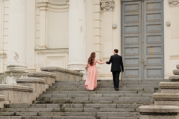 A beautiful wedding couple walks