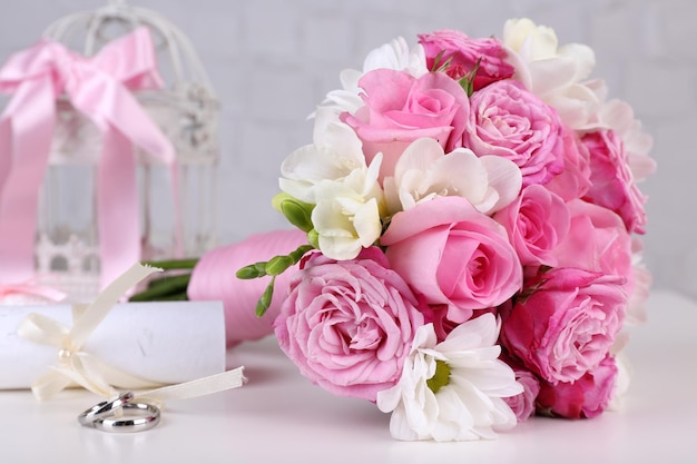 Beautiful wedding still life with bouquet on grey wall background