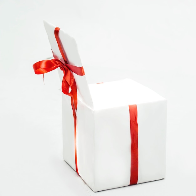 Beautiful white box with a red ribbon with the purchase