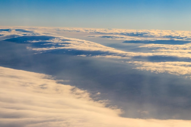 Beautiful white clouds in blue sky View from airplane