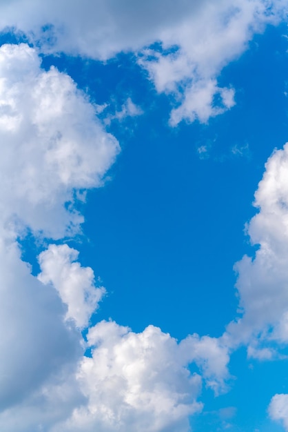 Beautiful white clouds on a bright blue background